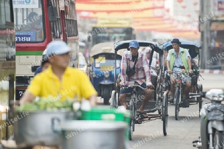 Bicycle Ricksha Taxis at the morning Market in Nothaburi in the north of city of Bangkok in Thailand in Southeastasia.