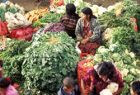 people in traditional clotes at the Market in the Village of  Chichi or Chichicastenango in Guatemala in central America.   