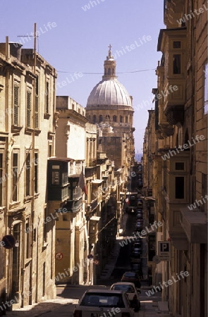 A smal road in the centre of the Old Town of the city of Valletta on the Island of Malta in the Mediterranean Sea in Europe.
