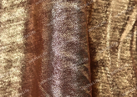 Detailed close up view on samples of cloth and fabrics in different colors found at a fabrics market.