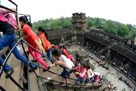 Tourists at the Angkor Wat in the Temple City of Angkor near the City of Siem Riep in the west of Cambodia.