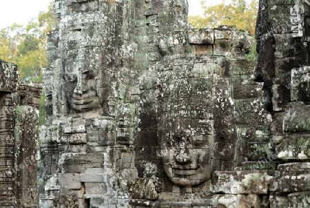 Stone Faces the Tempel Ruin of Angkor Thom in the Temple City of Angkor near the City of Siem Riep in the west of Cambodia.