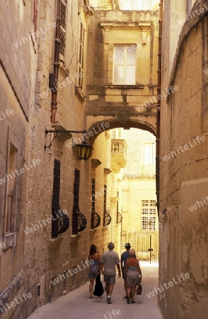 A smal road in the centre of the Old Town of the city of Valletta on the Island of Malta in the Mediterranean Sea in Europe.
