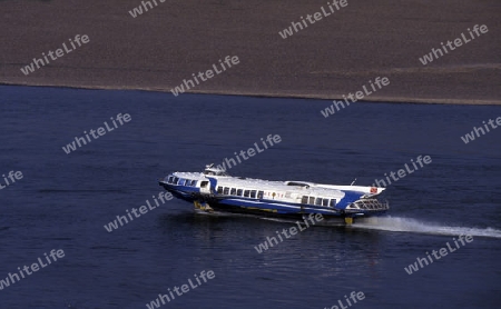 a speed boat at the landscape of the yangzee river in the three gorges valley up of the three gorges dam projecz in the province of hubei in china.