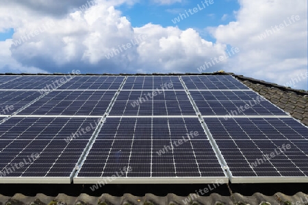 Solar panels producing clean energy on a roof of a residential house