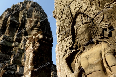 Stone Faces the Tempel Ruin of Angkor Thom in the Temple City of Angkor near the City of Siem Riep in the west of Cambodia.