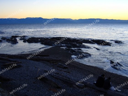 Couple in Evening Light on Gravel Beach