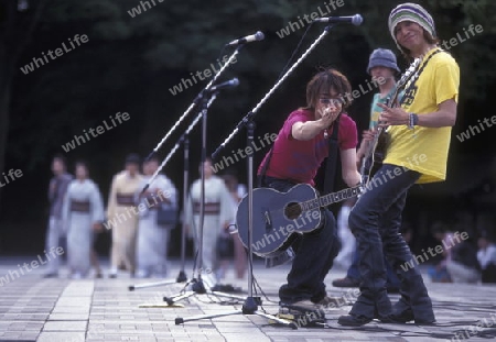 a Japanese Youth Punk Band plays on a square in the City of Tokyo in Japan in Asia,



