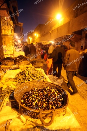 a smal Marketroad in the Medina of old City in the historical Town of Fes in Morocco in north Africa.