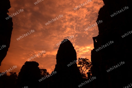 Stone Faces the Tempel Ruin of Angkor Thom in the Temple City of Angkor near the City of Siem Riep in the west of Cambodia.