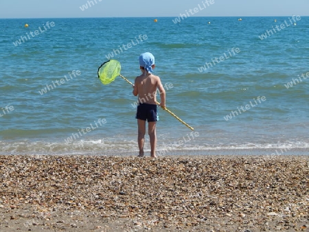 Kind am Strand