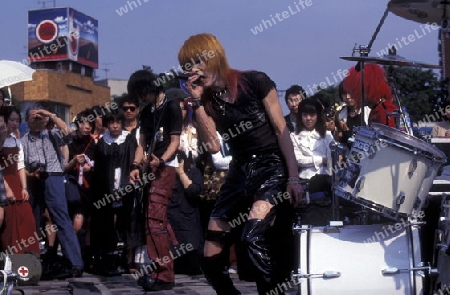 a Japanese Youth Punk Band plays on a square in the City of Tokyo in Japan in Asia,



