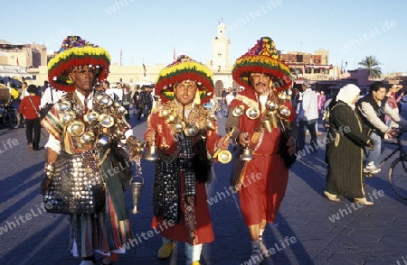 Traditional water seller at the Djemma del Fna Square in the old town of Marrakesh in Morocco in North Africa.
