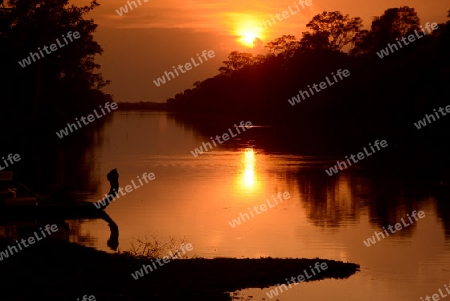 The River at the Bridge of Angkor Thom in the Temple City of Angkor near the City of Siem Riep in the west of Cambodia.