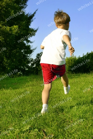 Boy in socks kicking a Ball