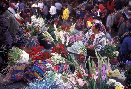 people in traditional clotes at the Market in the Village of  Chichi or Chichicastenango in Guatemala in central America.   