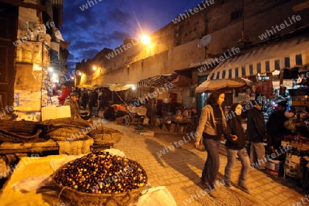 a smal Marketroad in the Medina of old City in the historical Town of Fes in Morocco in north Africa.