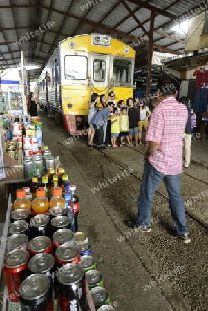 the Maeklong Railway Markt at the Maeklong railway station  near the city of Bangkok in Thailand in Suedostasien.