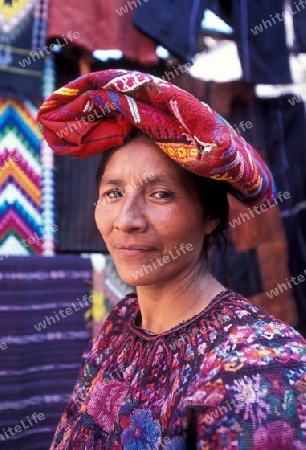 people in traditional clotes at the Market in the Village of  Chichi or Chichicastenango in Guatemala in central America.   