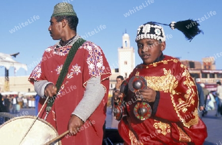 Traditional Music player at the Djemma del Fna Square in the old town of Marrakesh in Morocco in North Africa.
