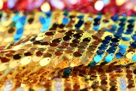 Detailed close up view on samples of cloth and fabrics in different colors found at a fabrics market.