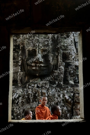 Stone Faces the Tempel Ruin of Angkor Thom in the Temple City of Angkor near the City of Siem Riep in the west of Cambodia.