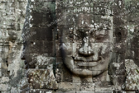 Stone Faces the Tempel Ruin of Angkor Thom in the Temple City of Angkor near the City of Siem Riep in the west of Cambodia.