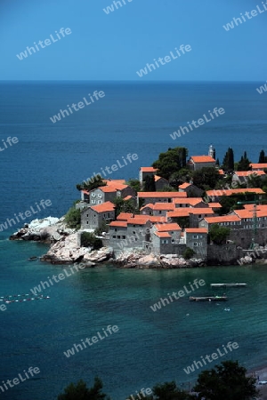 Die Altstadtinsel von Sveti Stefan in der Adria an der Kueste in Montenegro im Balkan am Mittelmeer in Europa.