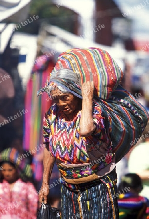 people in traditional clotes at the Market in the Village of  Chichi or Chichicastenango in Guatemala in central America.   