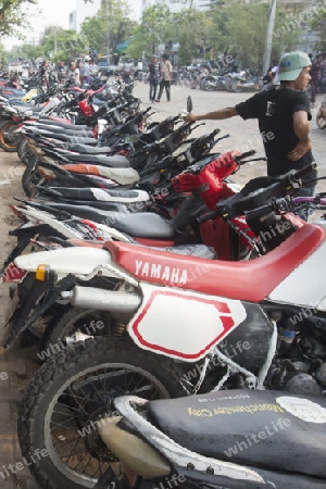 Motobike Parking at the Thingyan Water Festival at the Myanmar New Year in the city centre of Mandalay in Manamar in Southeastasia.