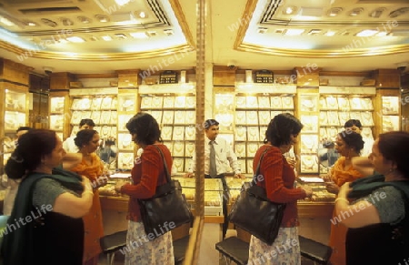 a Gold shop the souq or Market in the old town in the city of Dubai in the Arab Emirates in the Gulf of Arabia.