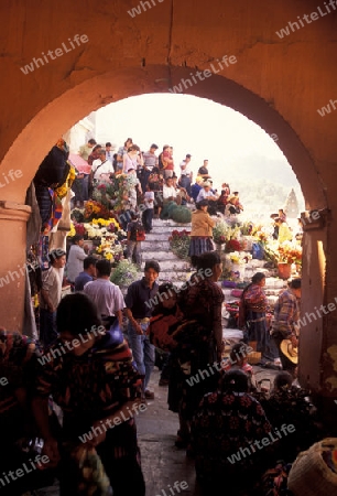 people in traditional clotes at the Market in the Village of  Chichi or Chichicastenango in Guatemala in central America.   