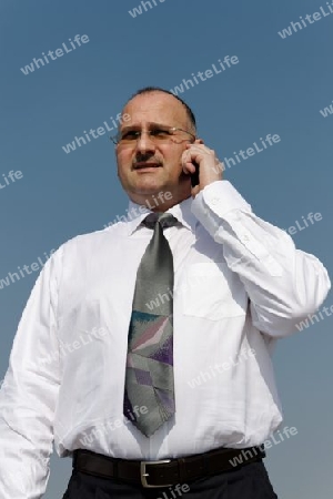 a businessman talking with his office