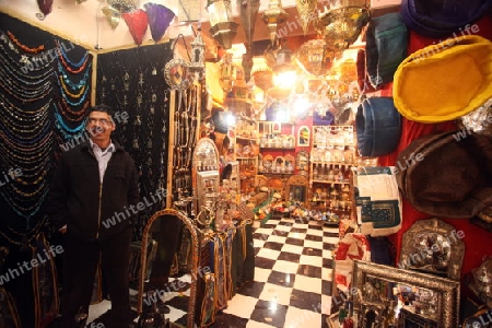 a shop in the Marketroad in the Medina of old City in the historical Town of Fes in Morocco in north Africa.