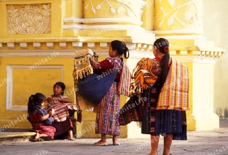 indio women at the church senora de la nerced in the old town in the city of Antigua in Guatemala in central America.   