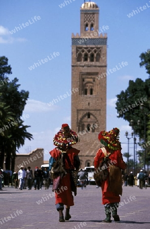 Traditional water seller at the Djemma del Fna Square in the old town of Marrakesh in Morocco in North Africa.
