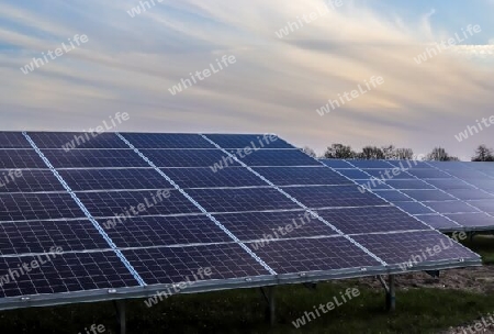 Generating clean energy with solar modules in a big park in northern Europe.