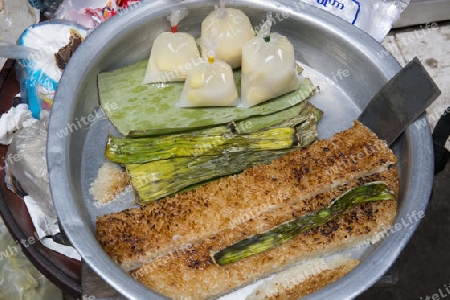 streetfood at a marketstreet in the City of Mandalay in Myanmar in Southeastasia.