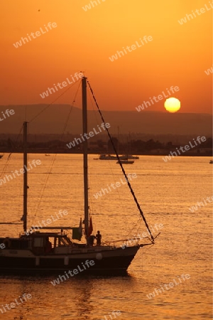 a Sunset at the old Town of Siracusa in Sicily in south Italy in Europe.