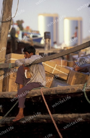 Import and export goods at the harbour at the Dubai creek in the old town in the city of Dubai in the Arab Emirates in the Gulf of Arabia.