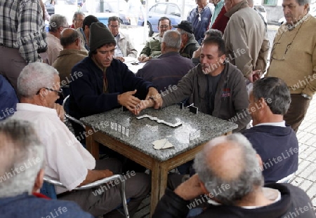 people play game in a cafe shop in the City of Arrecife on the Island of Lanzarote on the Canary Islands of Spain in the Atlantic Ocean. on the Island of Lanzarote on the Canary Islands of Spain in the Atlantic Ocean.
