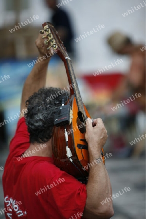 streetmusic in the old Town of  Taormina in Sicily in south Italy in Europe.