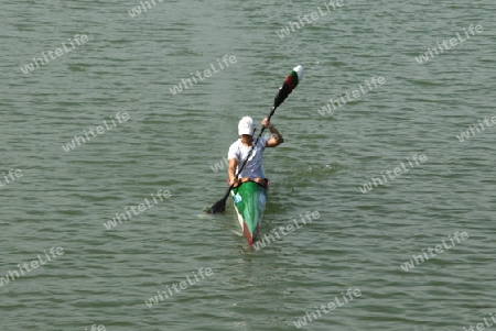 Young woman training rowing