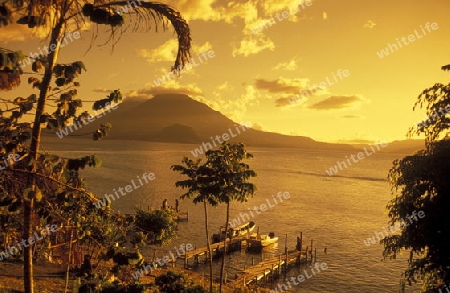 The Lake Atitlan mit the Volcanos of Toliman and San Pedro in the back at the Town of Panajachel in Guatemala in central America.   