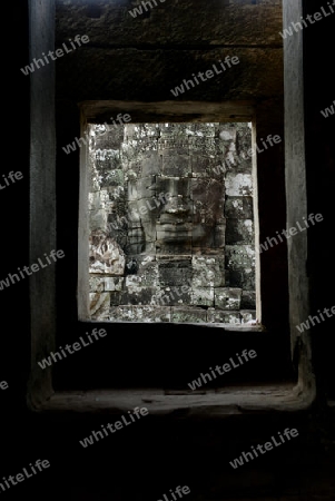 Stone Faces the Tempel Ruin of Angkor Thom in the Temple City of Angkor near the City of Siem Riep in the west of Cambodia.