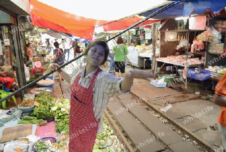 the Maeklong Railway Markt at the Maeklong railway station  near the city of Bangkok in Thailand in Suedostasien.