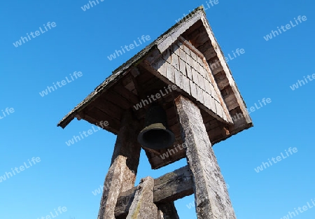 Some kind of mini churchbell under a fantastic blue winter sky