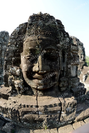 Stone Faces the Tempel Ruin of Angkor Thom in the Temple City of Angkor near the City of Siem Riep in the west of Cambodia.