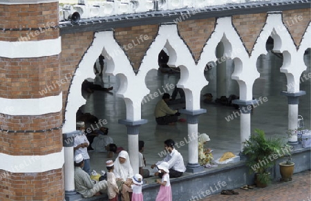 Muslim prayers at a Mosque in the city of  Kuala Lumpur in Malaysia in southeastasia.