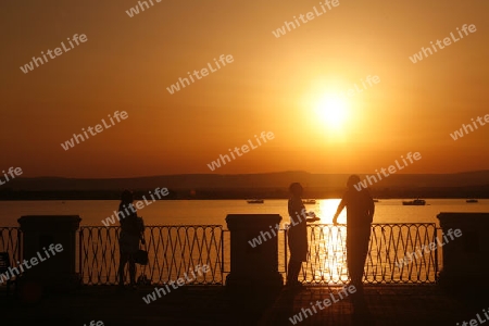 a Sunset at the old Town of Siracusa in Sicily in south Italy in Europe.